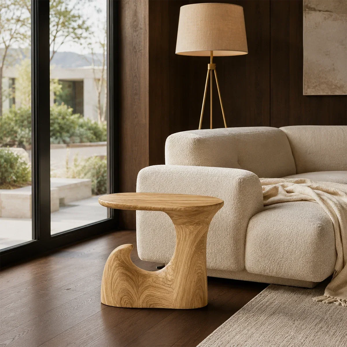 Statement end table with open sculptural form and bold lines in a calm home setting