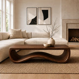 Unique coffee table with sculpted curves and open form in a bright contemporary interior