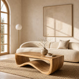 Statement coffee table with bold flowing silhouette in a sophisticated living room