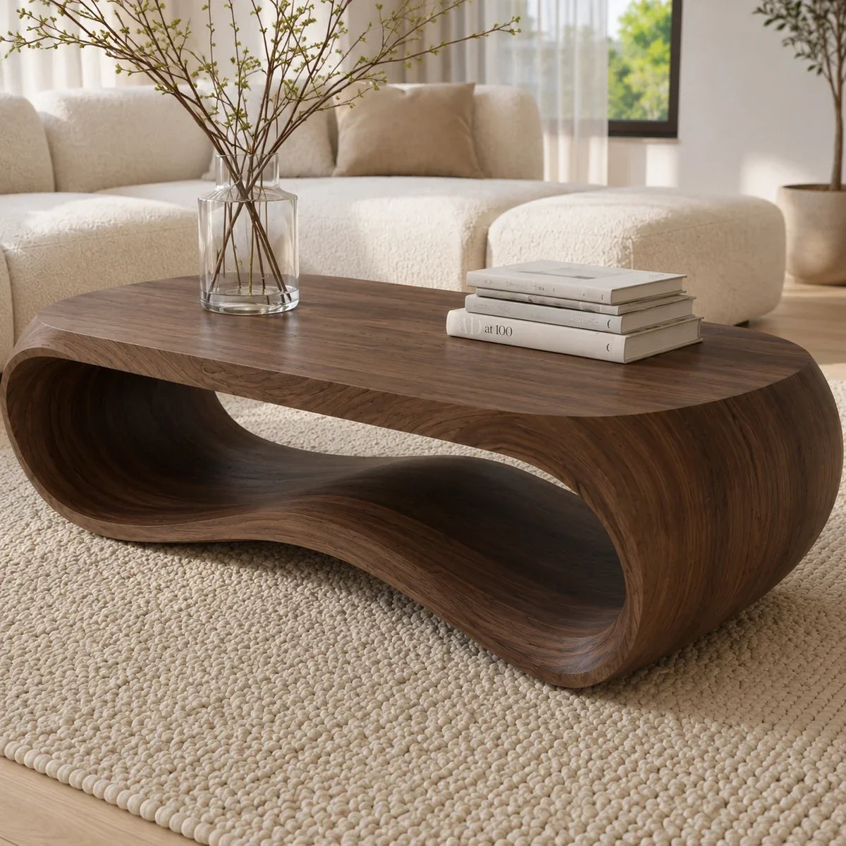 Organic coffee table with sculpted loop base and handcrafted solid wood construction