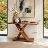 Statement foyer table with angular crossed supports and a broad tabletop display